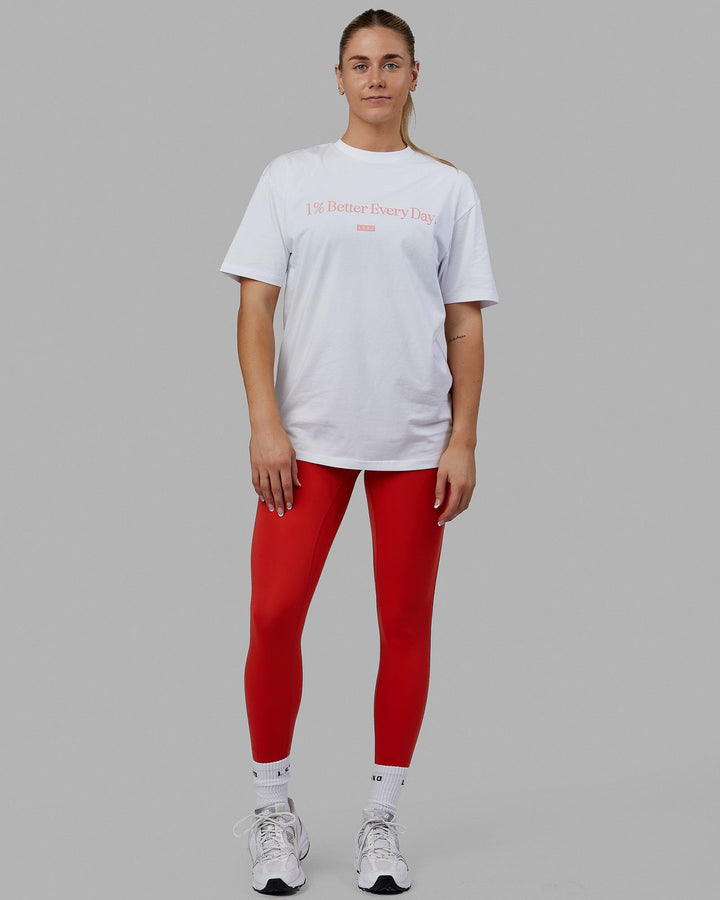 Woman wearing Unisex 1% Better FLXCotton Tee Oversize - White-Coral