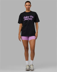 Woman wearing Unisex Enjoy The Journey FLXCotton Tee Oversize - Black-Light Violet