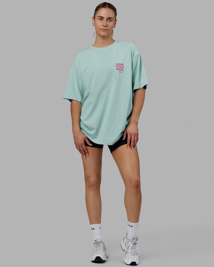 Woman wearing Unisex Good Times Heavyweight Tee Oversize - Pastel Turquoise-Spark Pink
