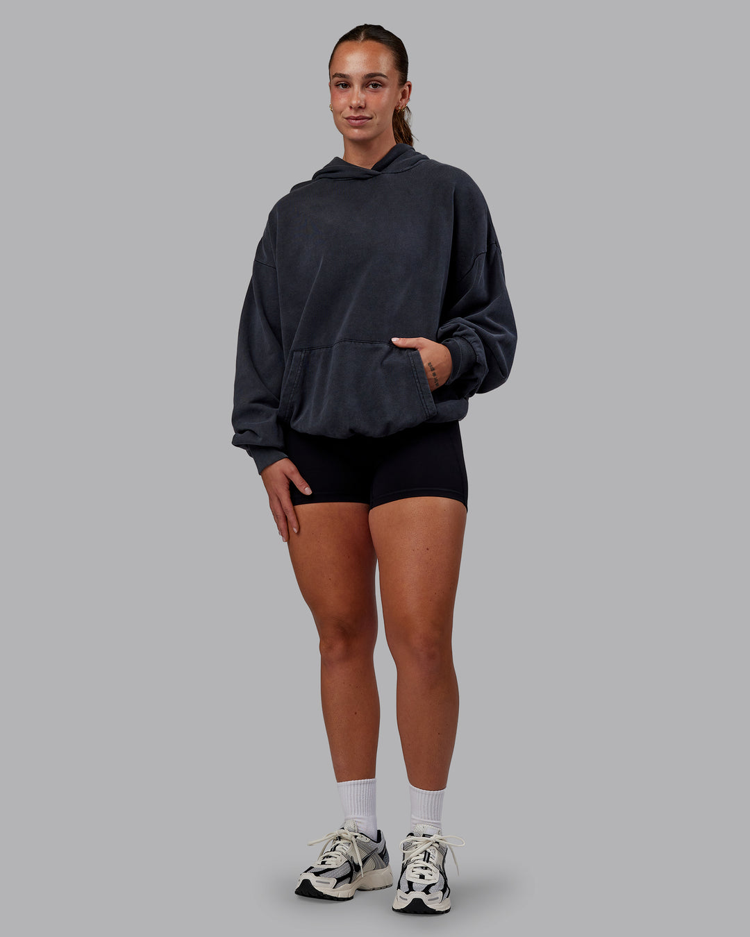 Woman wearing Set the Standard Washed Oversized Hoodie in Black-Black | Size:S