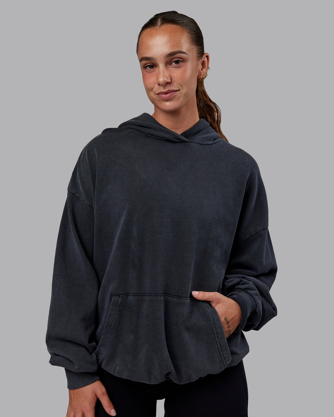 Woman wearing Set the Standard Washed Oversized Hoodie in Black-Black | Size:S