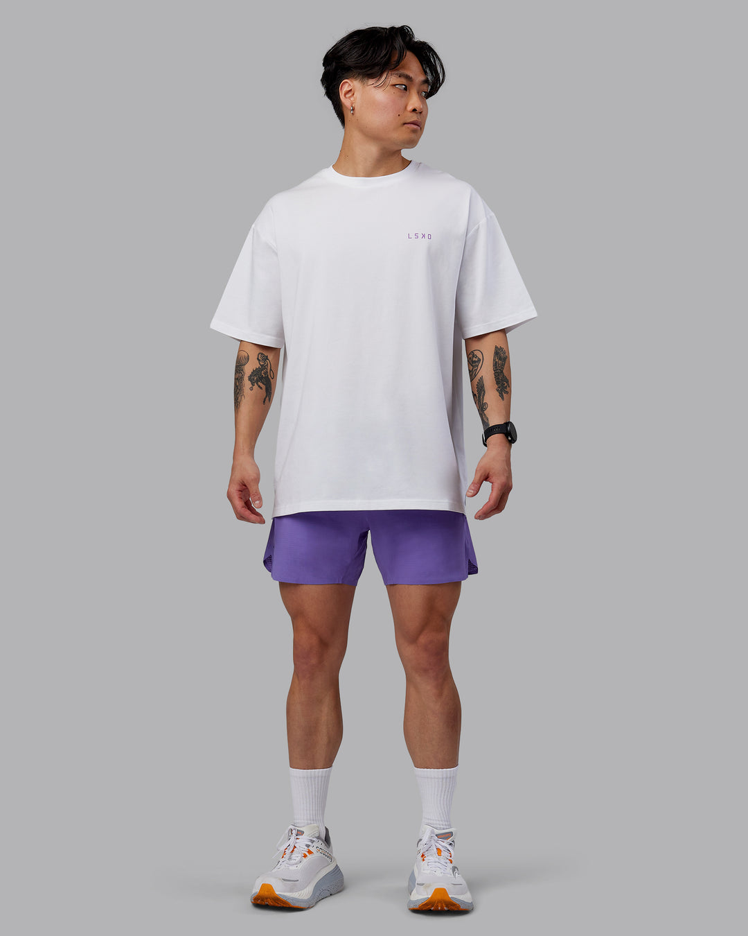 Man wearing Unisex Strike Through FLXCotton Tee Oversize - White-Purple Swirl