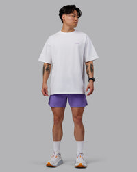 Man wearing Unisex Strike Through FLXCotton Tee Oversize - White-Purple Swirl