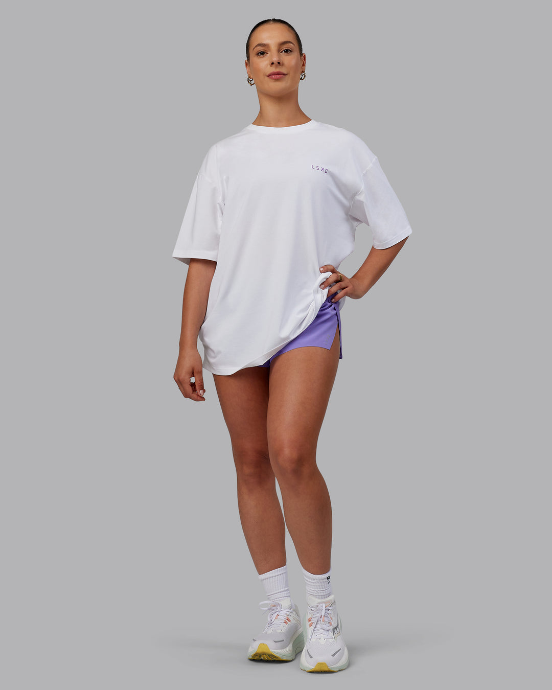 Woman wearing Unisex Strike Through FLXCotton Tee Oversize - White-Purple Swirl