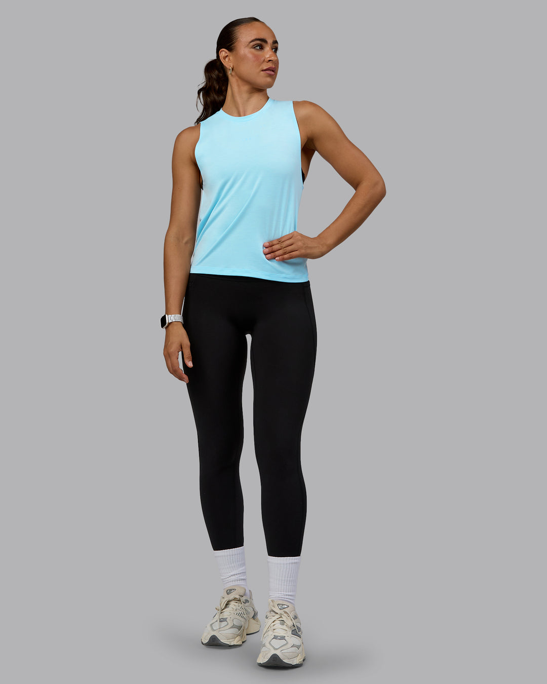 Woman wearing Unleash Training Tank - Glacial Blue