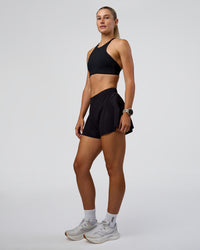 Woman wearing Unstoppable Lined Short - Black | Model:Emelia | Size:S