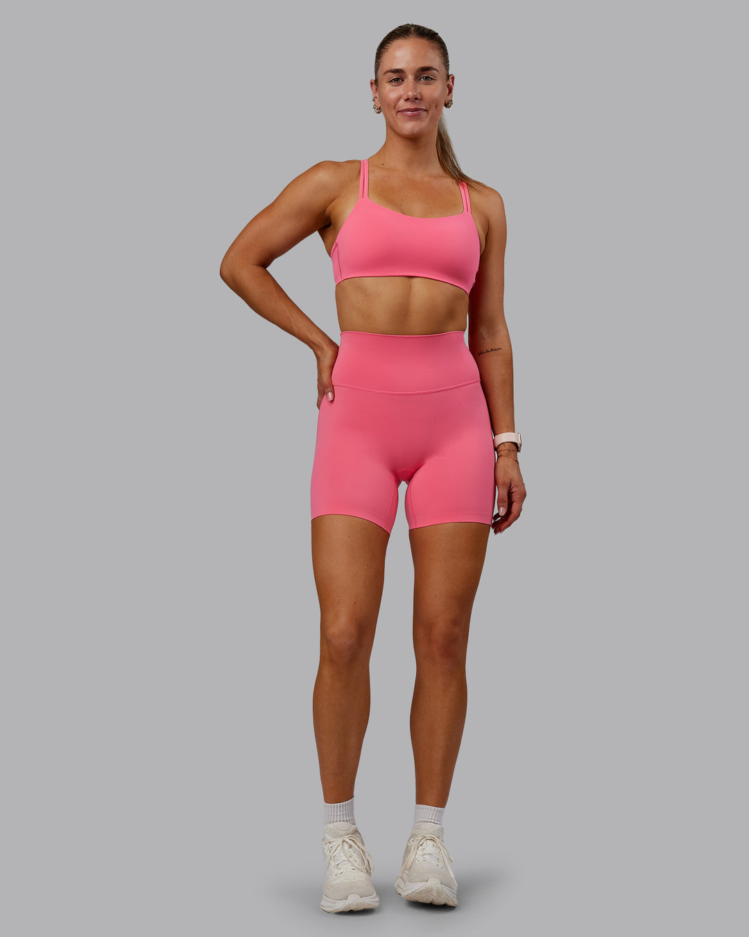 Woman wearing Vantage Sports Bra in Pink Lemonade | Size:S