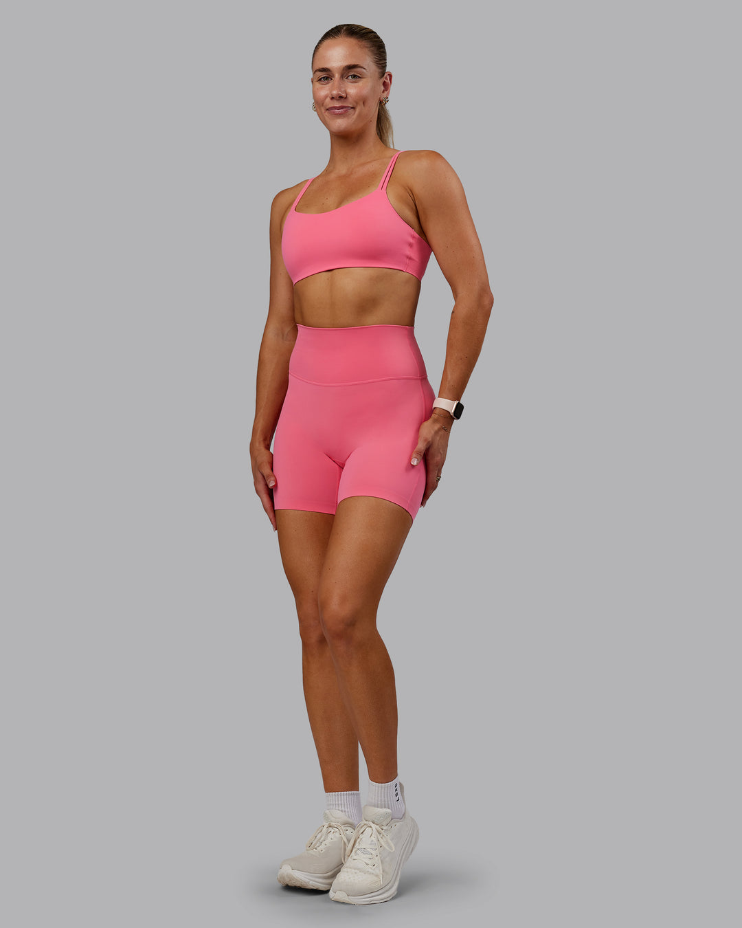 Woman wearing Vantage Sports Bra in Pink Lemonade | Size:S