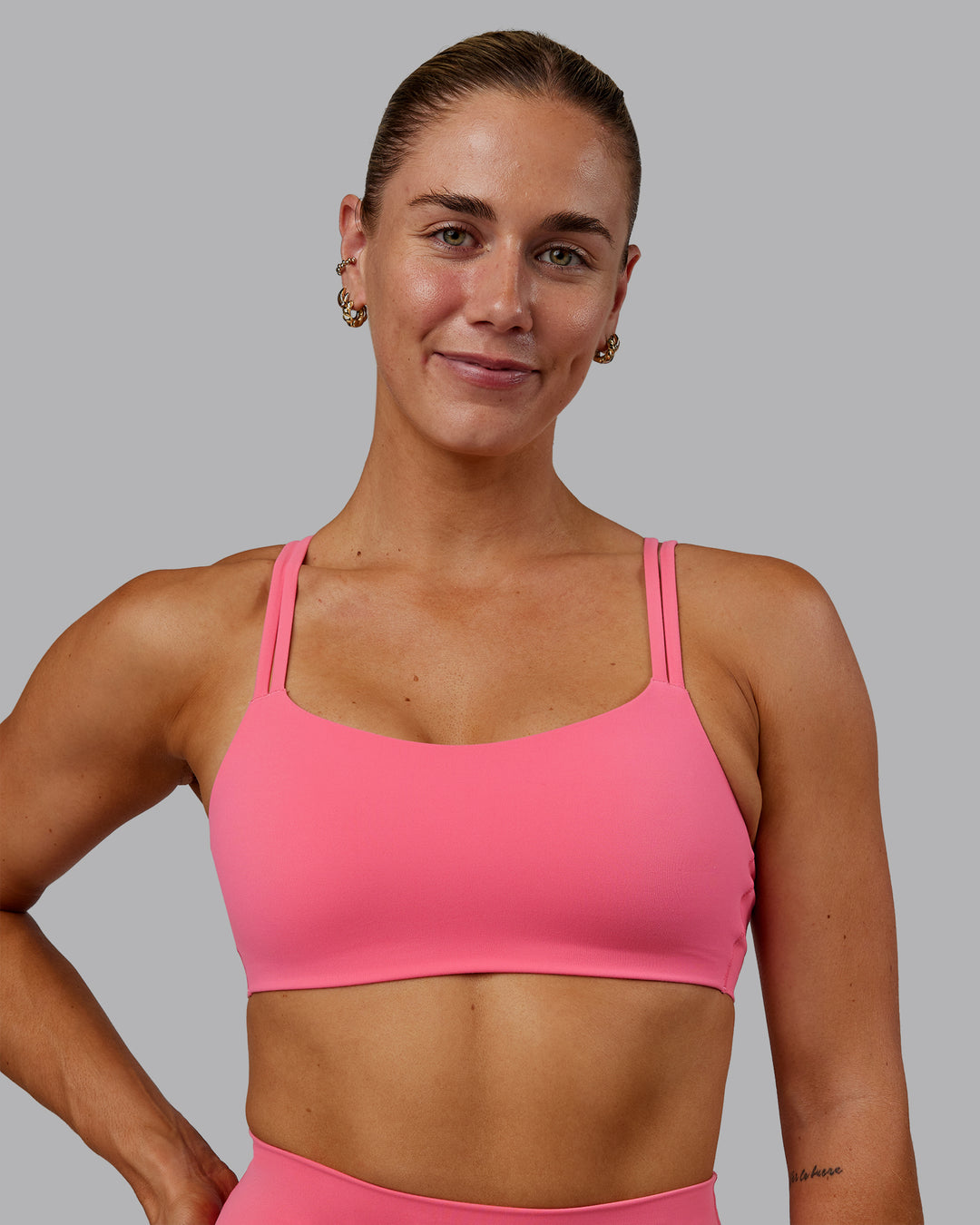 Woman wearing Vantage Sports Bra in Pink Lemonade | Size:S