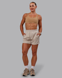 Woman wearing Vantage Sports Bra in Warm Smoke | Size:S