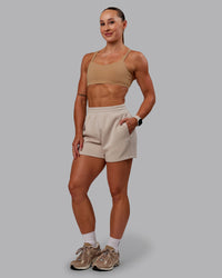 Woman wearing Vantage Sports Bra in Warm Smoke | Size:S