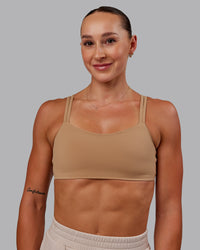 Woman wearing Vantage Sports Bra in Warm Smoke | Size:S