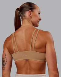 Woman wearing Vantage Sports Bra in Warm Smoke | Size:S