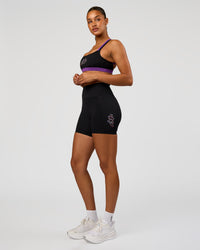 Woman wearing Velocity Graphic Sports Bra - Black-Radiate | Model:Rosie | Size:S