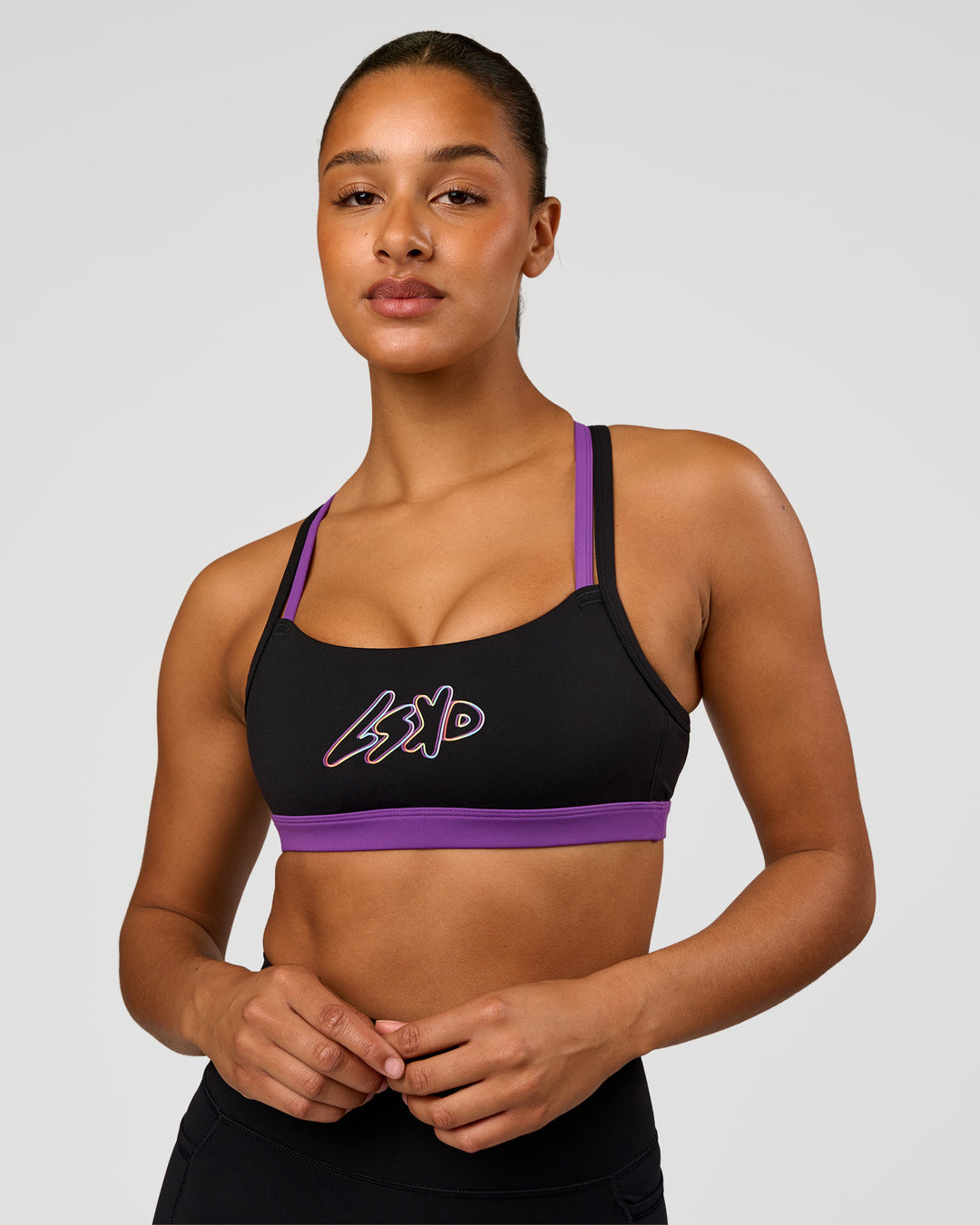 Woman wearing Velocity Graphic Sports Bra - Black-Radiate | Model:Rosie | Size:S