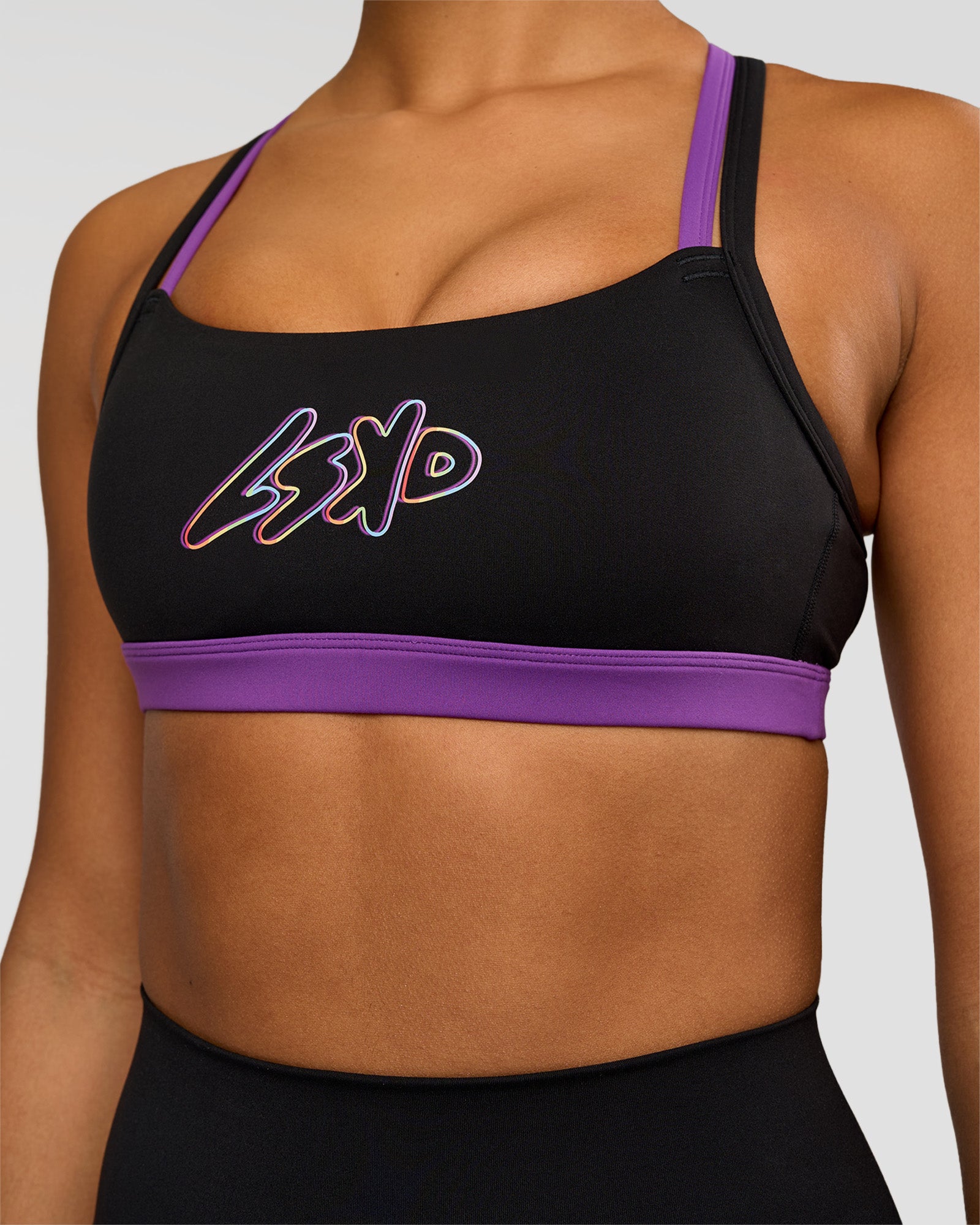Woman wearing Velocity Graphic Sports Bra - Black-Radiate | Model:Rosie | Size:S