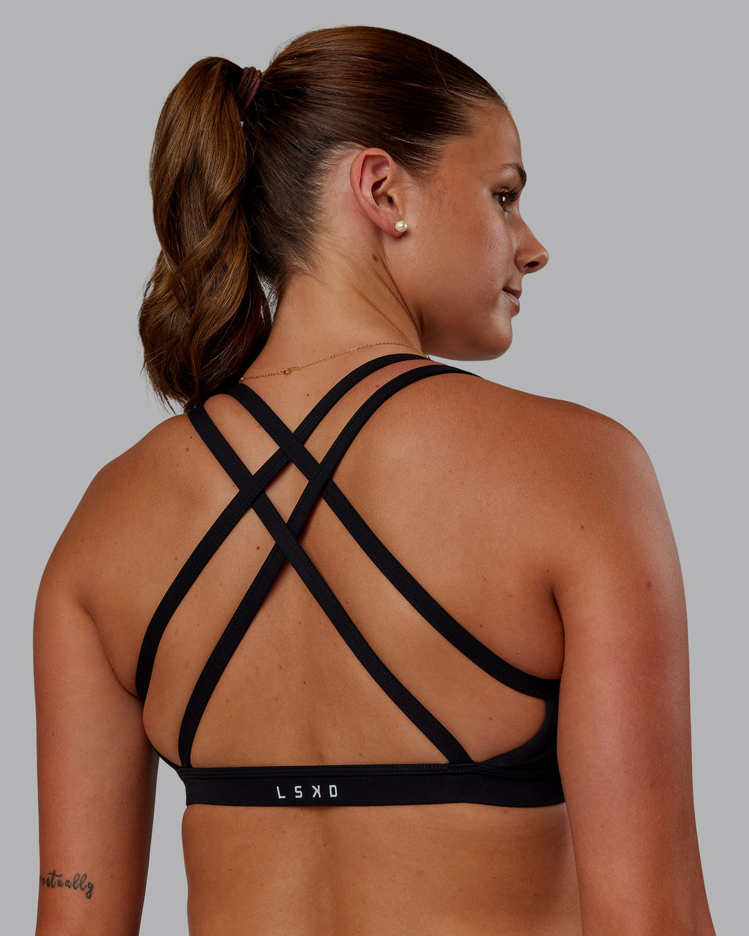 Woman wearing Velocity Sports Bra - Black | Model:Phoebe | Size:S
