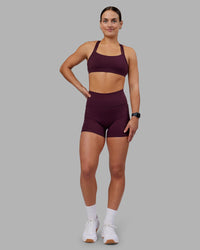 Woman wearing Velocity Sports Bra - Cherry Lacquer | Model:Keisha | Size:S