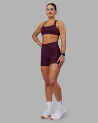 Woman wearing Velocity Sports Bra - Cherry Lacquer | Model:Keisha | Size:S