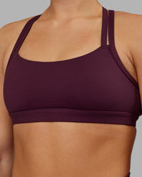 Woman wearing Velocity Sports Bra - Cherry Lacquer | Model:Keisha | Size:S