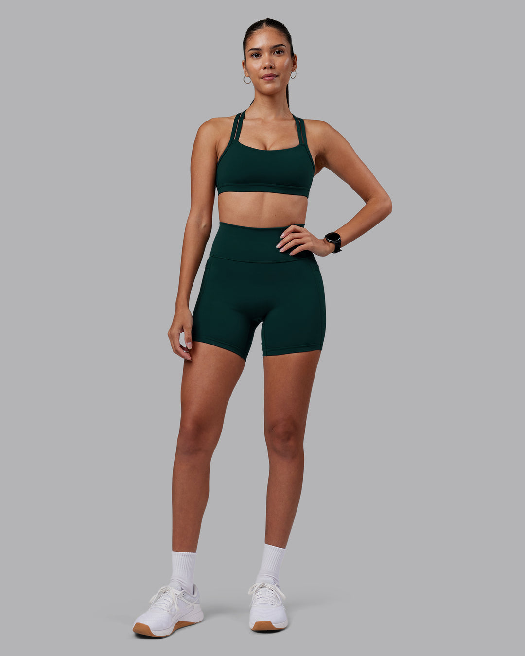 Woman wearing Velocity Sports Bra - Dark Moss | Model:Rhiley | Size:S