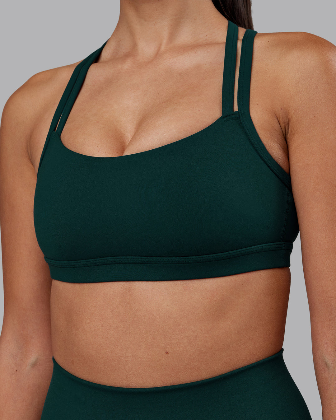 Woman wearing Velocity Sports Bra - Dark Moss | Model:Rhiley | Size:S
