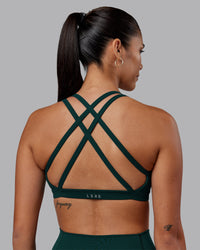 Woman wearing Velocity Sports Bra - Dark Moss | Model:Rhiley | Size:S