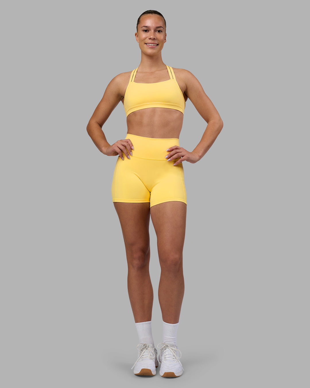 Woman wearing Velocity Sports Bra - Lemon | Model:Charlize | Size:S