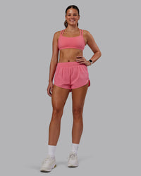 Woman wearing Velocity Sports Bra -- Pink Lemonade | Model:Phoebe | Size:S
