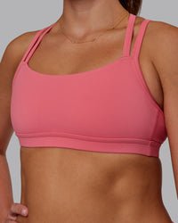 Woman wearing Velocity Sports Bra - Pink Lemonade | Model:Phoebe | Size:S