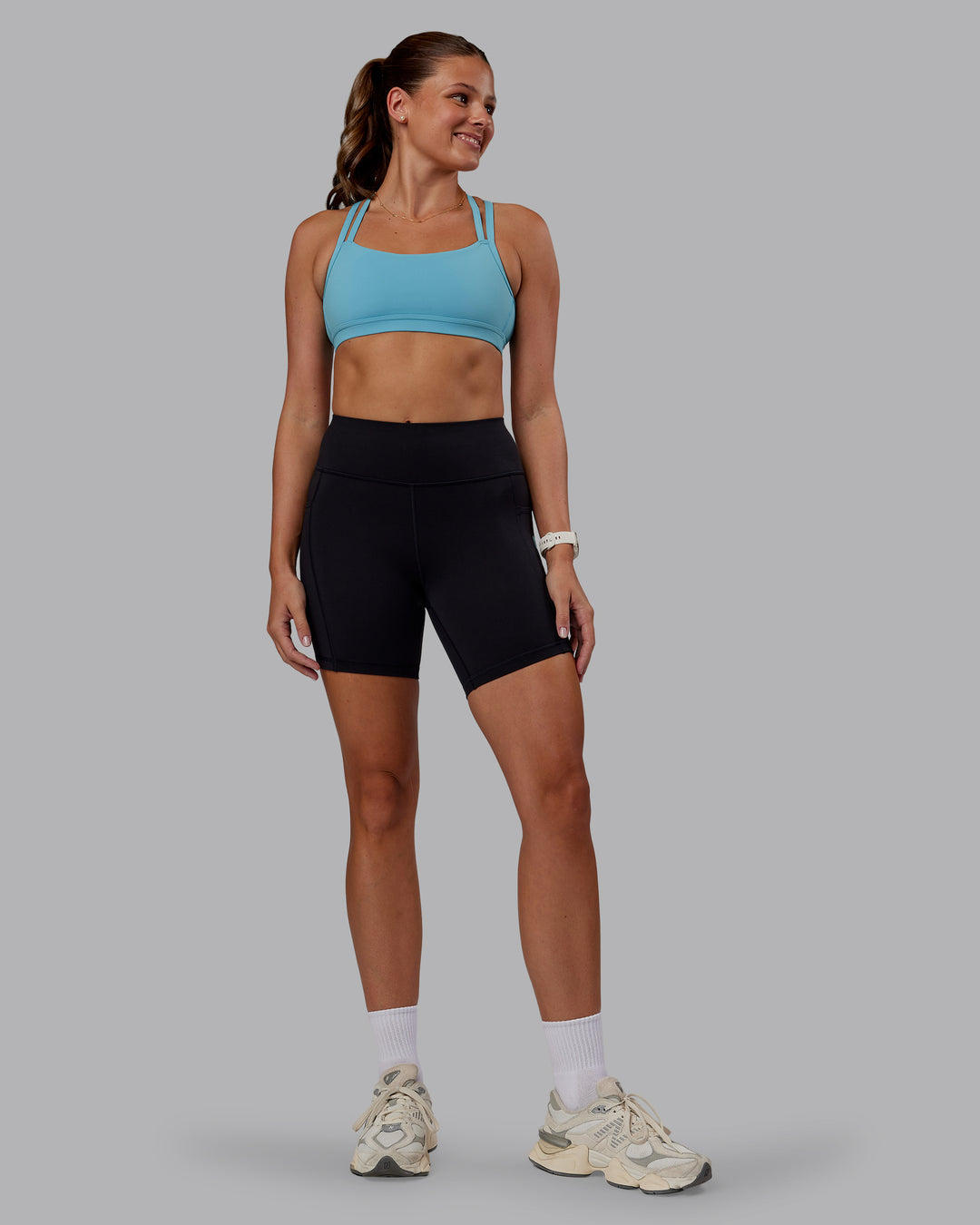 Woman wearing Velocity Sports Bra - Retro Blue | Model:Phoebe | Size:S