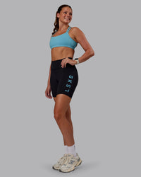 Woman wearing Velocity Sports Bra - Retro Blue | Model:Phoebe | Size:S