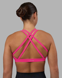 Woman wearing Velocity Sports Bra - Ultra Pink | Model:Keisha | Size:S