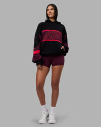 Woman wearing Vibe Oversized Unisex Hoodie - Black-Cherry Lacquer | Model:Rhiley | Size:S | Thumbnail Index: 7
