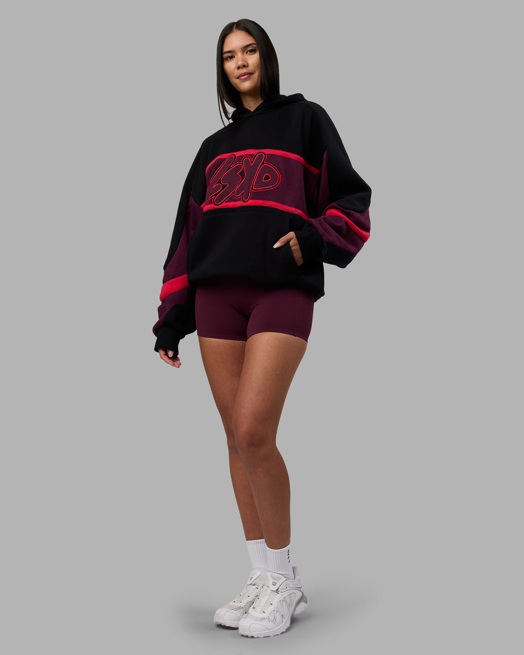 Woman wearing Vibe Oversized Unisex Hoodie - Black-Cherry Lacquer | Model:Rhiley | Size:S - view 5