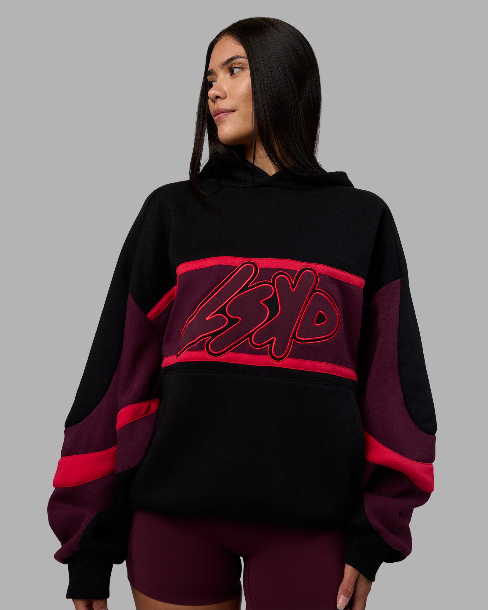 Woman wearing Vibe Oversized Unisex Hoodie - Black-Cherry Lacquer | Model:Rhiley | Size:S