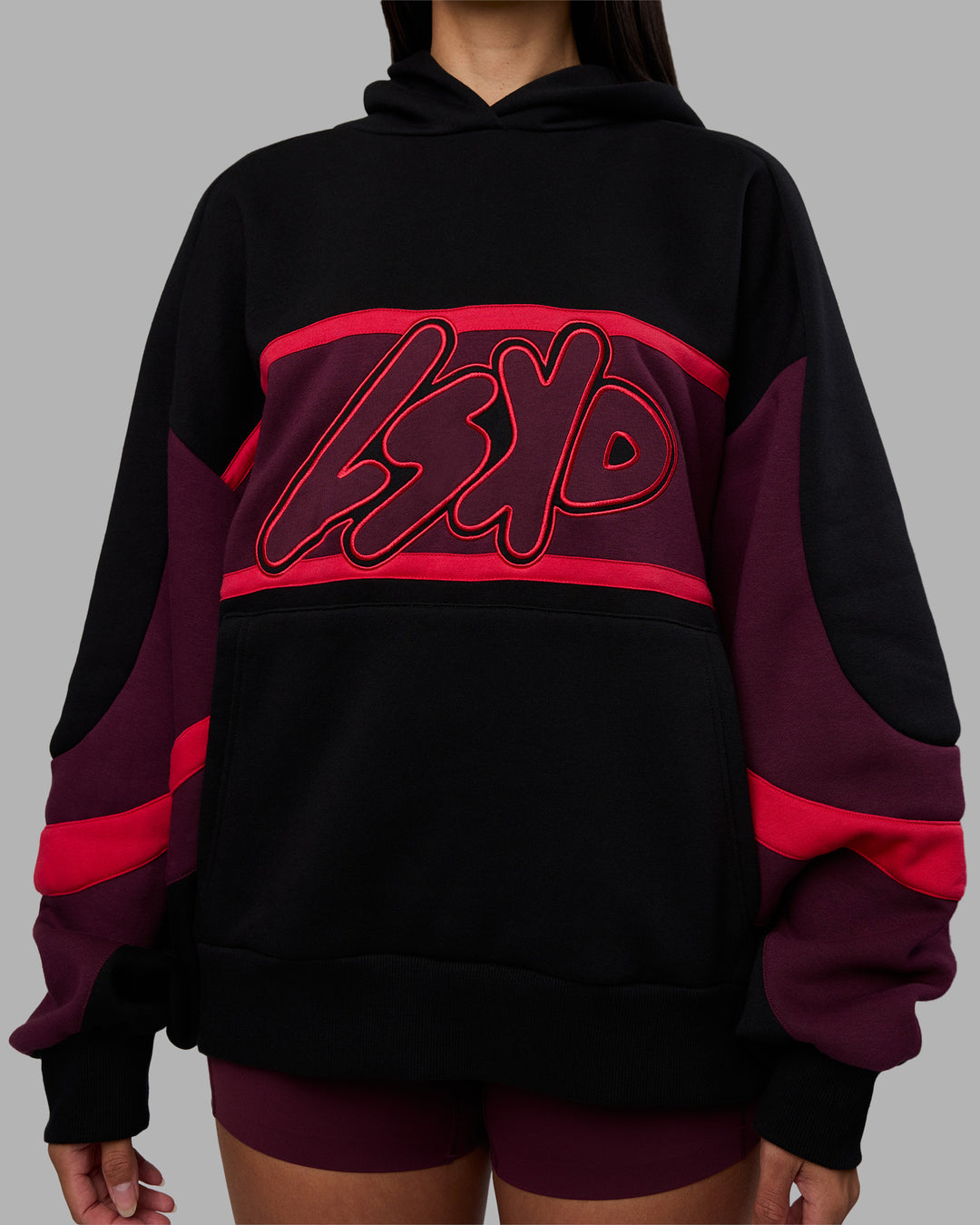 Woman wearing Vibe Oversized Unisex Hoodie - Black-Cherry Lacquer | Model:Rhiley | Size:S - view 9