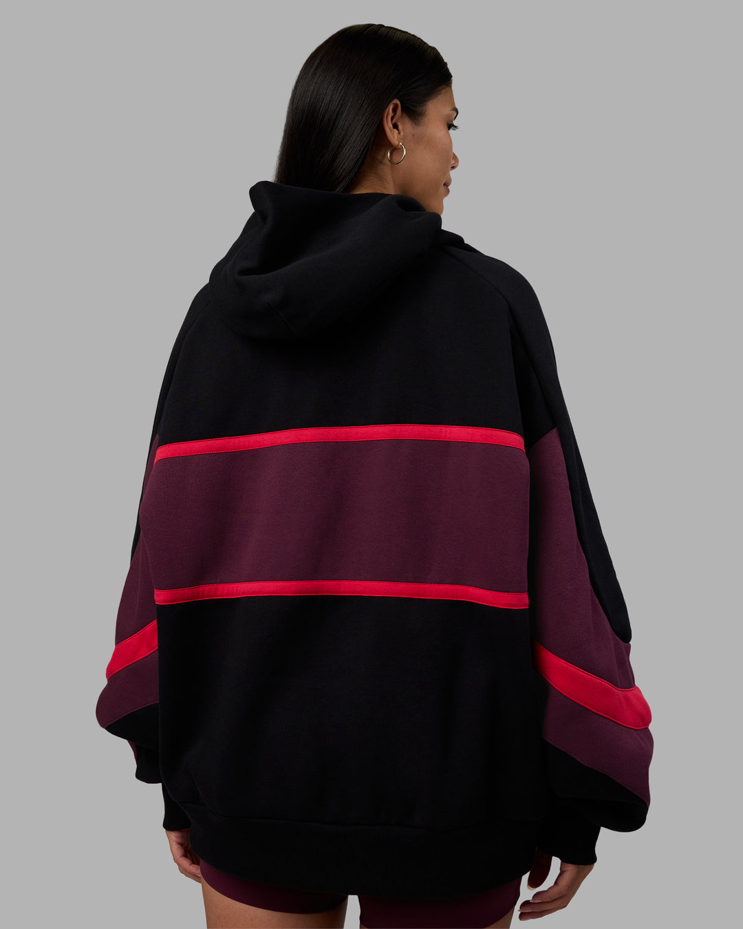 Woman wearing Vibe Oversized Unisex Hoodie - Black-Cherry Lacquer | Model:Rhiley | Size:S - view 11