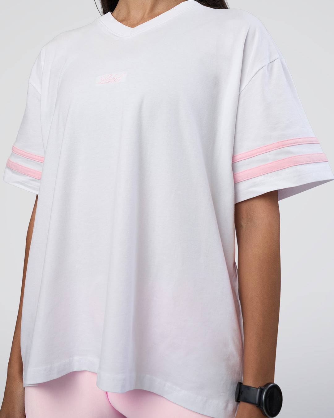 Woman wearing Victory FLXCotton Oversized Tee - White-Marshmallow | Model:Rhiley | Size:S