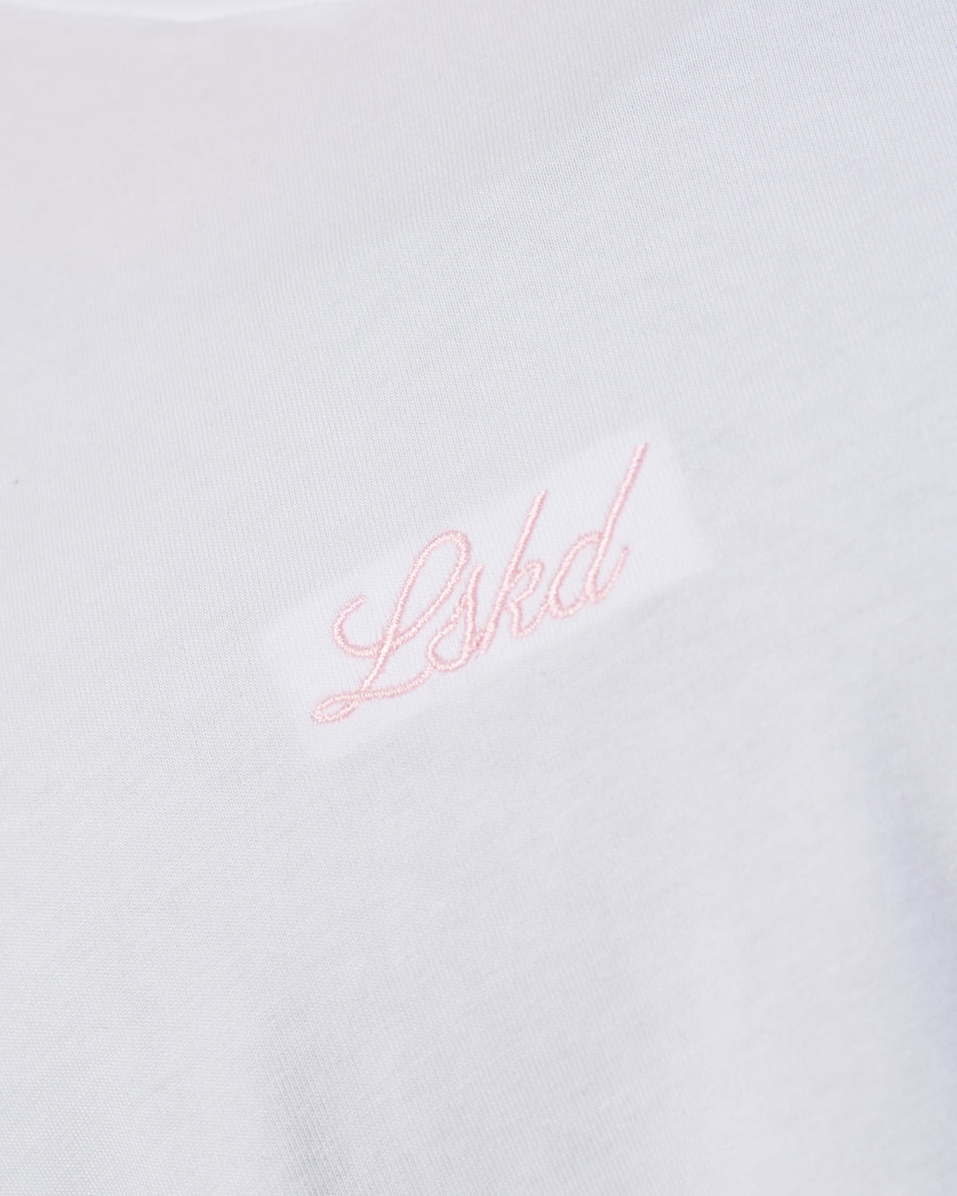 Woman wearing Victory FLXCotton Oversized Tee - White-Marshmallow | Model:Rhiley | Size:S