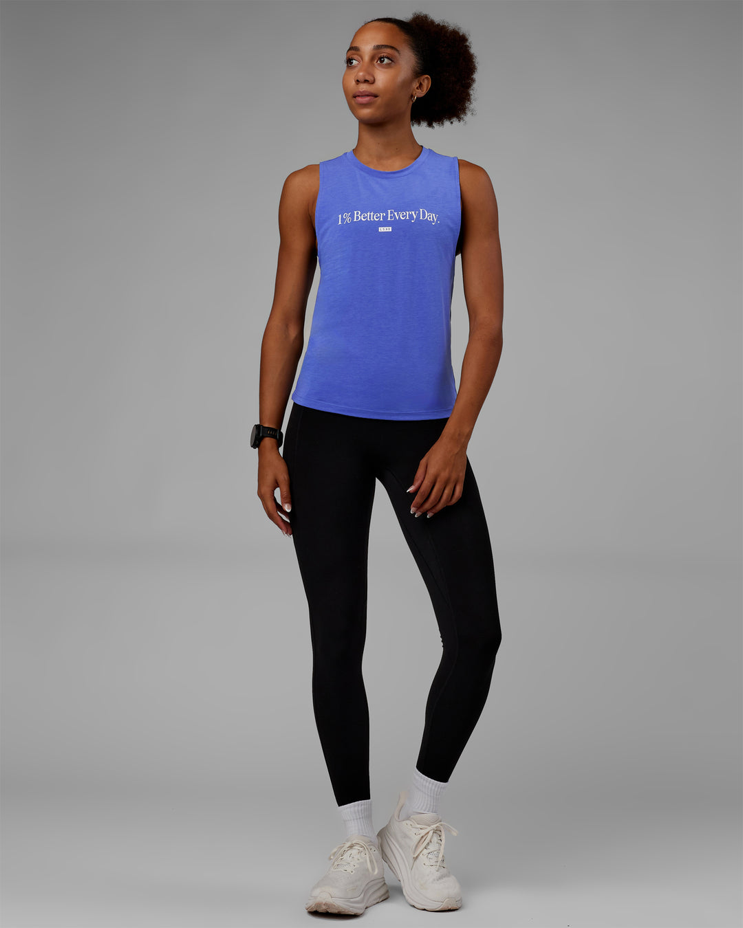 Woman wearing Vital 1% Better Training Tank - Power Cobalt-White
