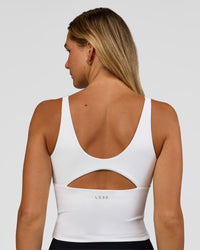 Woman wearing Vitality Active Tank - White | Model:Amity | Size:S