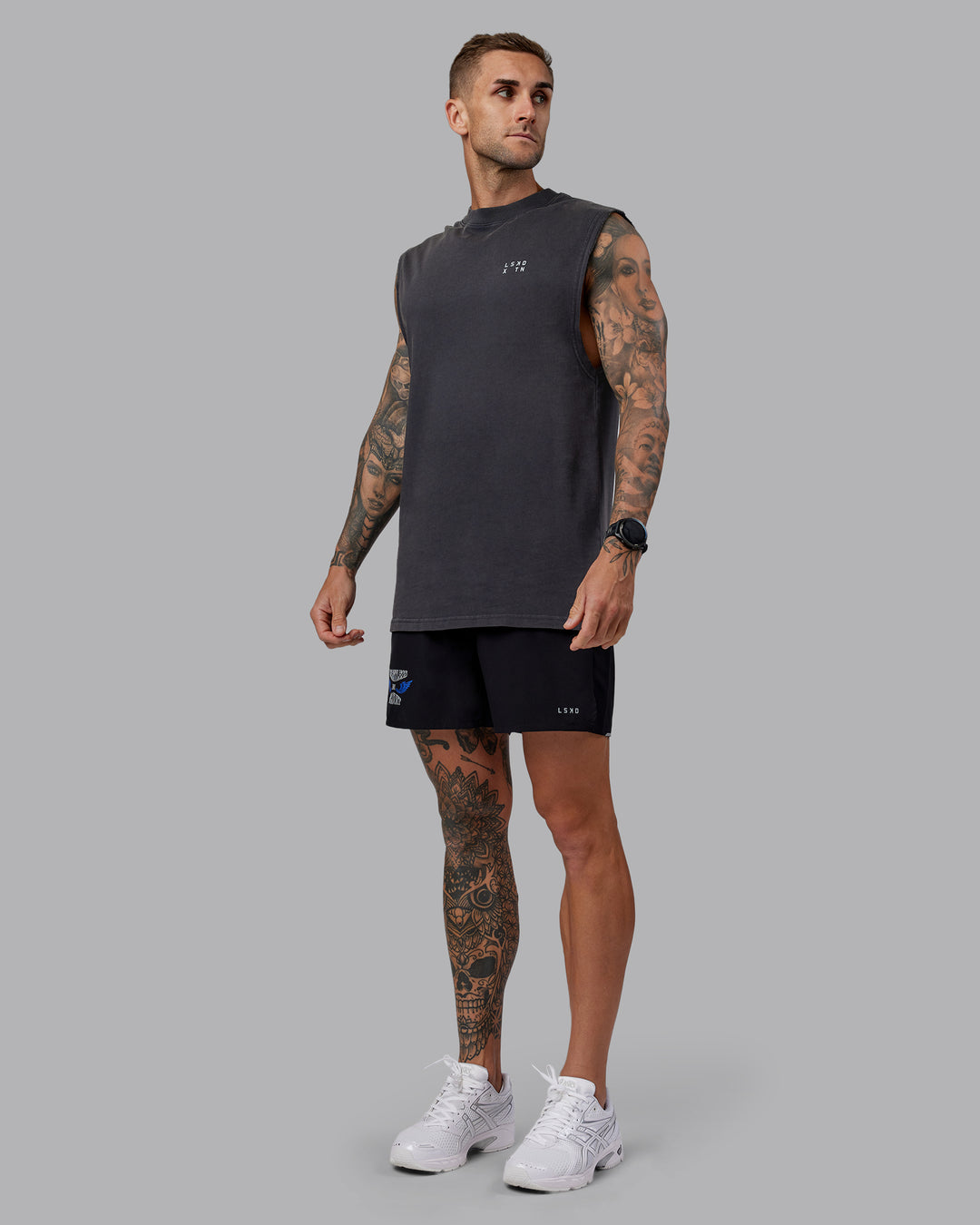 Man wearing Washed Relentless Heavyweight Oversized Tank - Black-Grey | Model:Tommy | Size:S