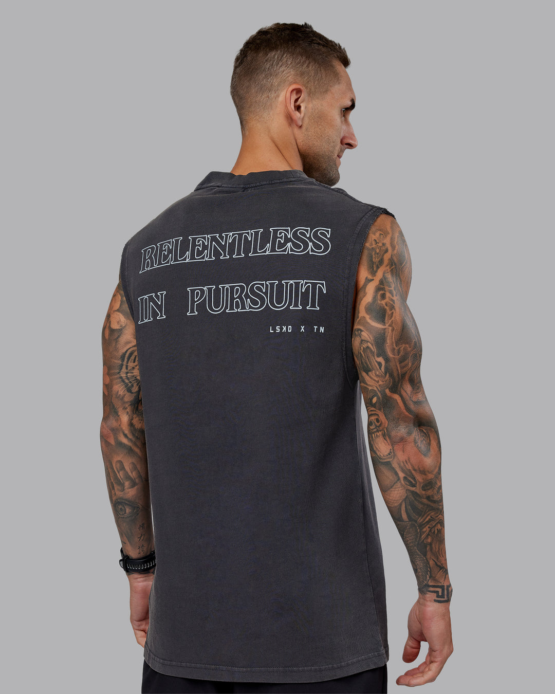 Man wearing Washed Relentless Heavyweight Oversized Tank - Black-Grey | Model:Tommy | Size:S