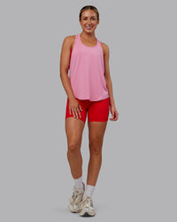 Woman wearing AeroFLX+ Drop Armhole Seamless Tank - Candy Pink | Model:Paris | Size:S