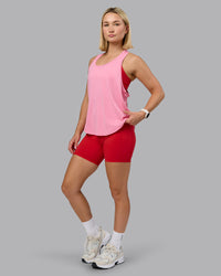 Woman wearing AeroFLX+ Drop Armhole Seamless Tank - Candy Pink | Model:Halle | Size:S