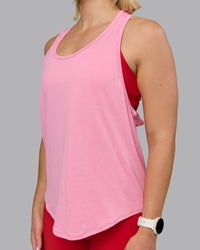 Woman wearing AeroFLX+ Drop Armhole Seamless Tank - Candy Pink | Model:Halle | Size:S