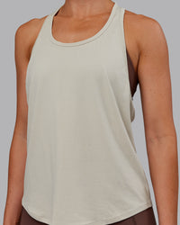 Woman wearing AeroFLX+ Drop Armhole Seamless Tank - Shale Beige | Model:Paris | Size:S