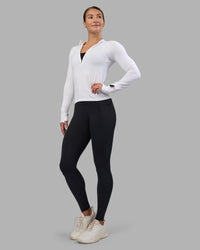 Woman wearing AeroFLX+ Long Sleeve Half Zip - White/White | Model:Hannah | Size:S
