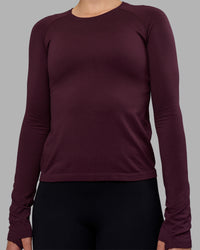 Woman wearing AeroFLX+ Seamless Long Sleeve Tee - Cherry Lacquer/Cherry Lacquer | Model:Charlize | Size:S